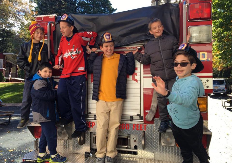 Our Students Posing on the Fire Truck having a great time!