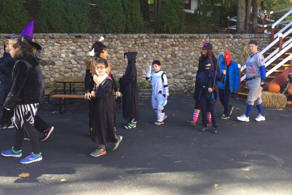 Our students in their costumes marching through the Halloween Parade!