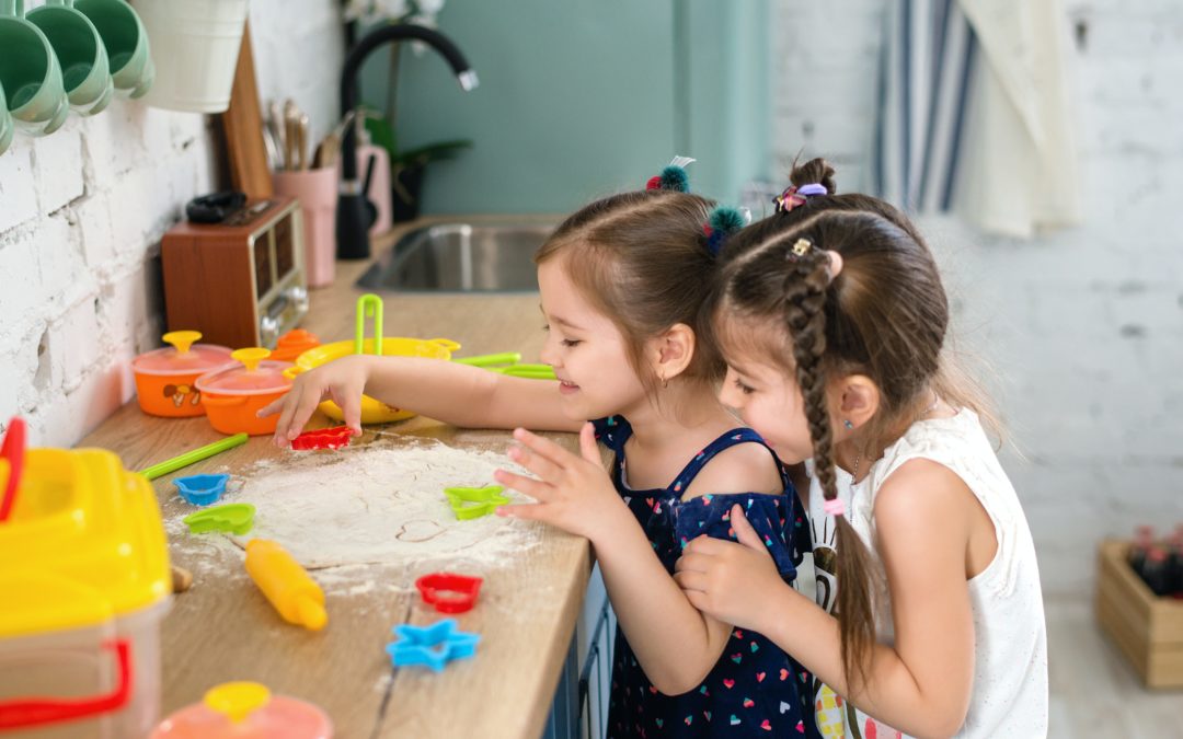 two kids playing. Appearing in an article about play therapy.