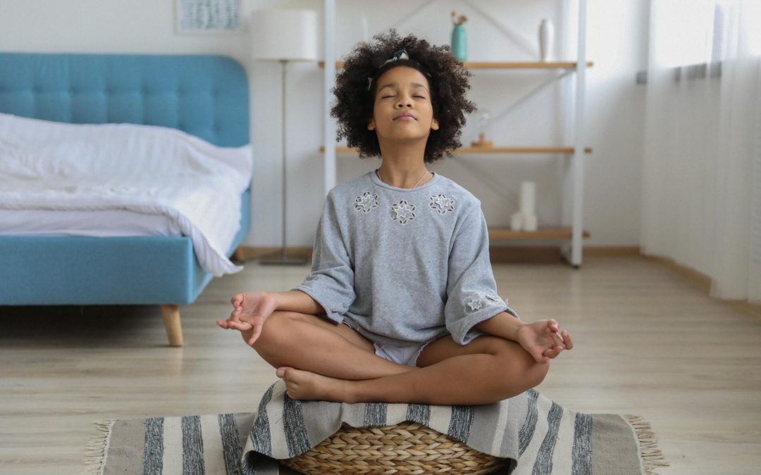 Child mediating in their room